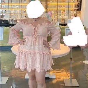 L’Atiste Pink eyelet bell sleeve illusion mini dress with lace up bodice